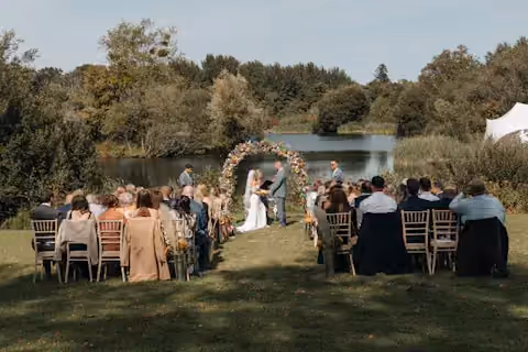 Outdoor lakeside wedding ceremony