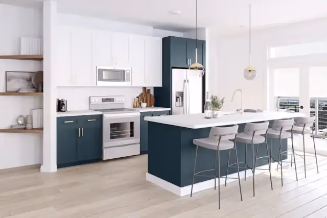Bright kitchen with a navy island and bar stools